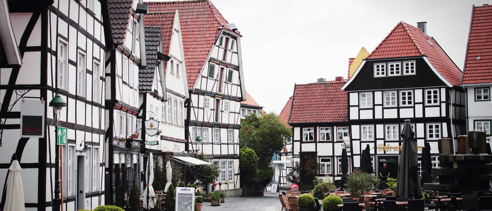 A german village filled with shops, cafes, and resting areas.